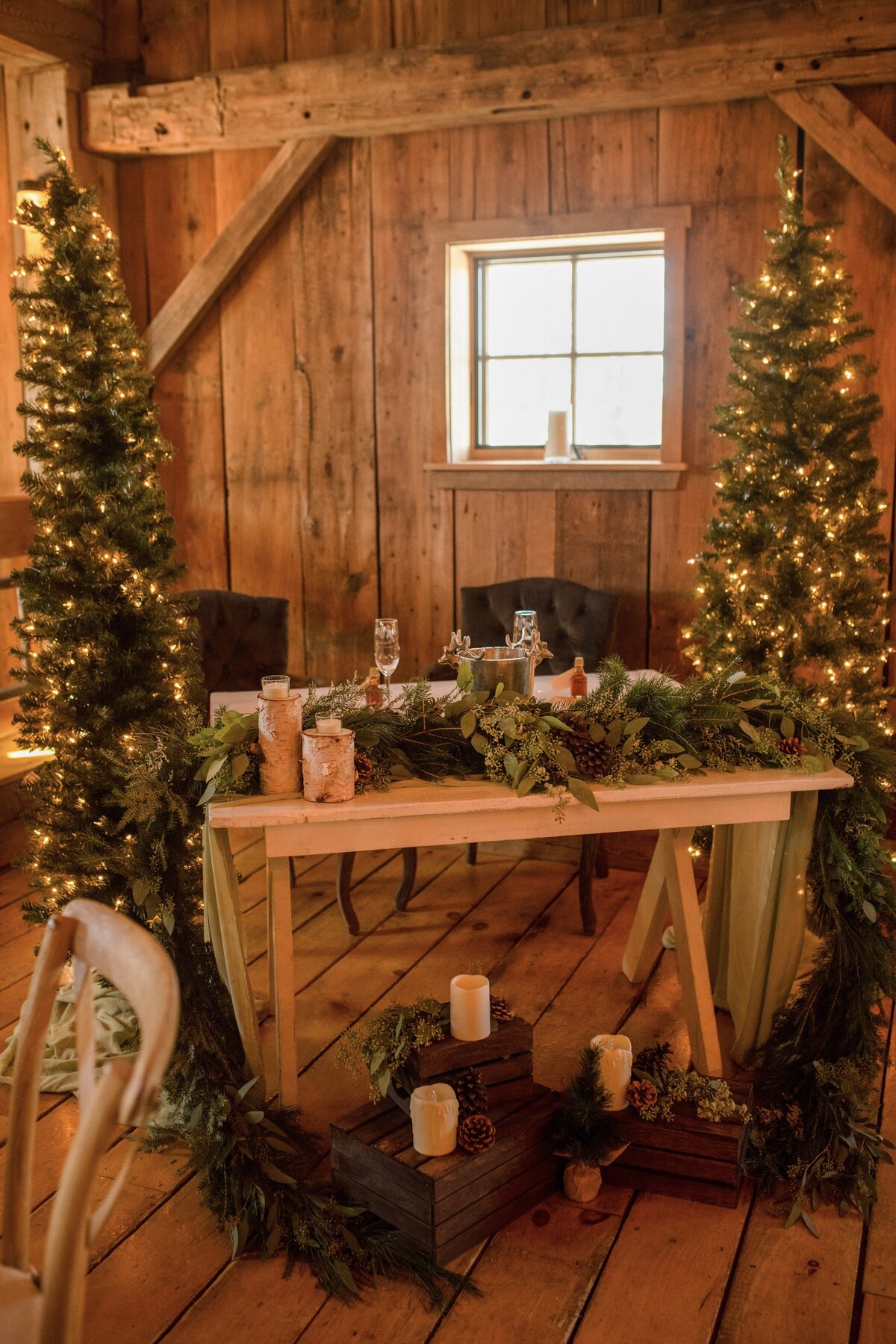 Wintry garland and candles cascading across the sweetheart table