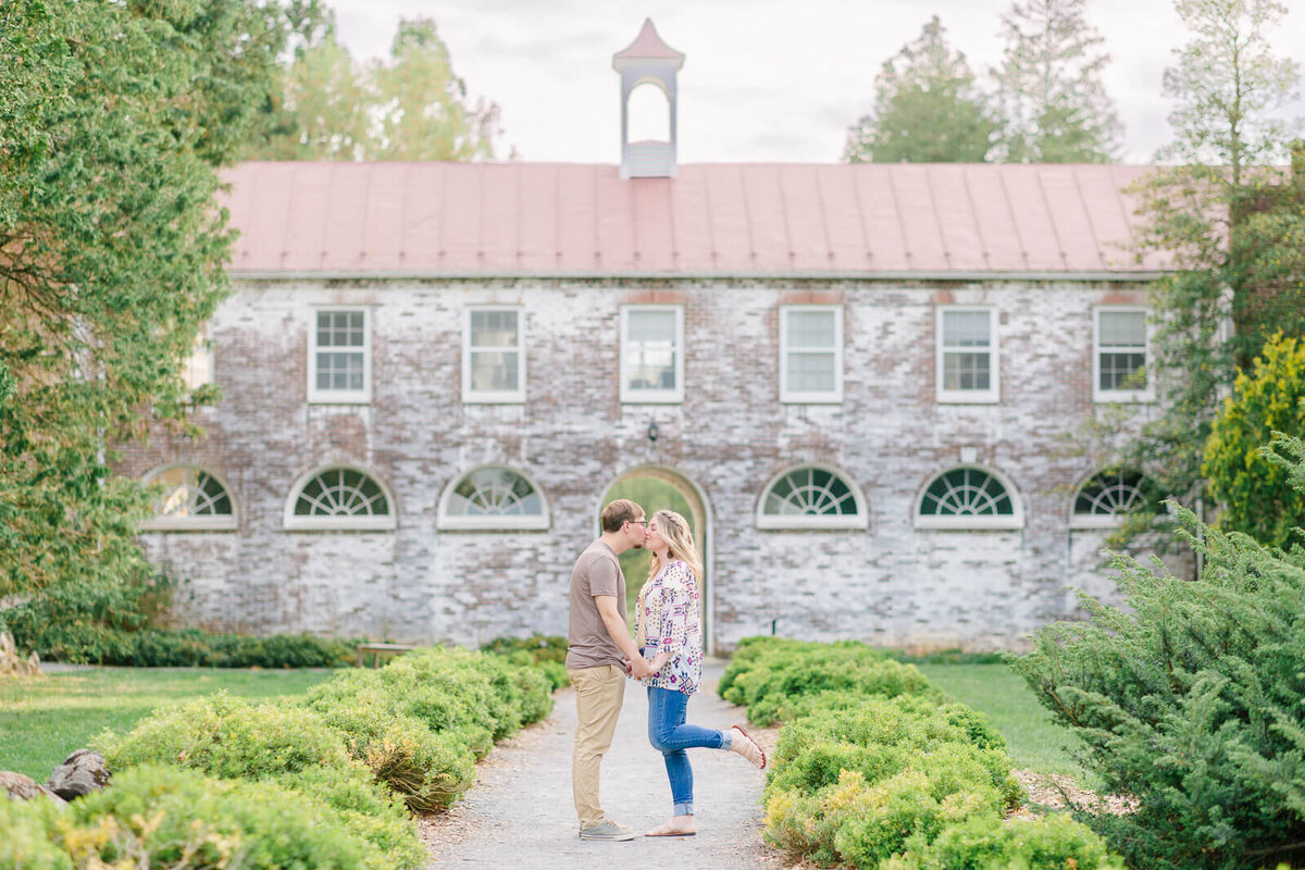 Couple taking Engagement Photos at the Blandy Experimental Farm at the UVA Arboretum in Boyce, Virginia. Captured by Bethany Aubre Photography.