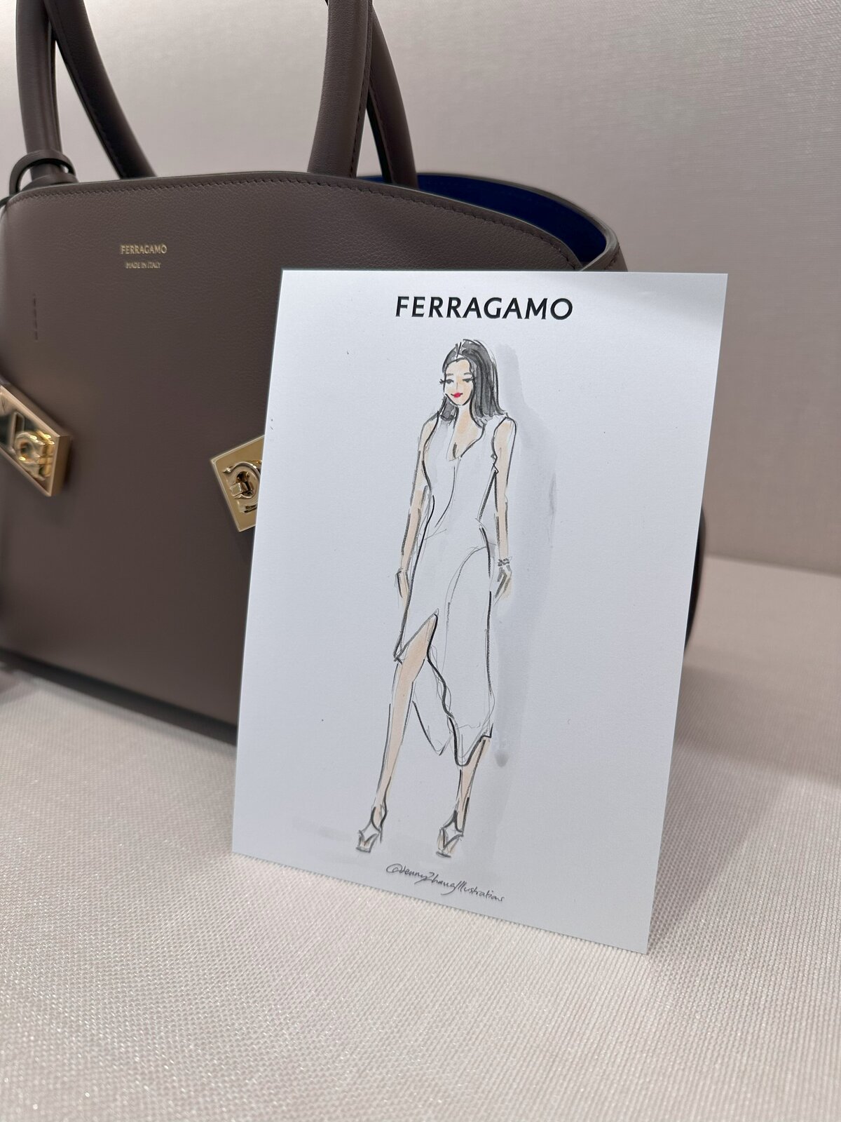 luxury brand experience showcasing live drawing of ferragamo dress during a boutique activation