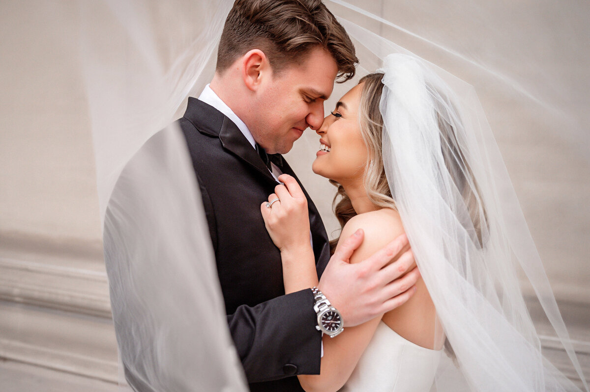 fun candid happy wedding picture under the veil