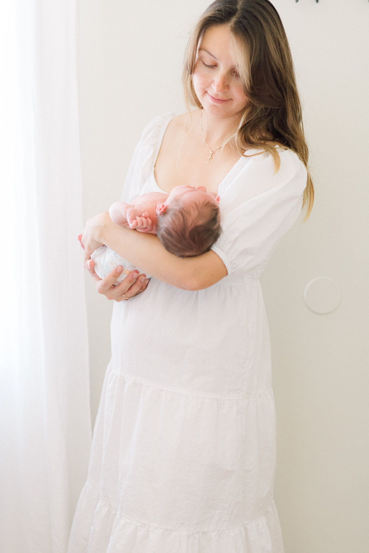 white-studio-lifestyle-newborn-photo