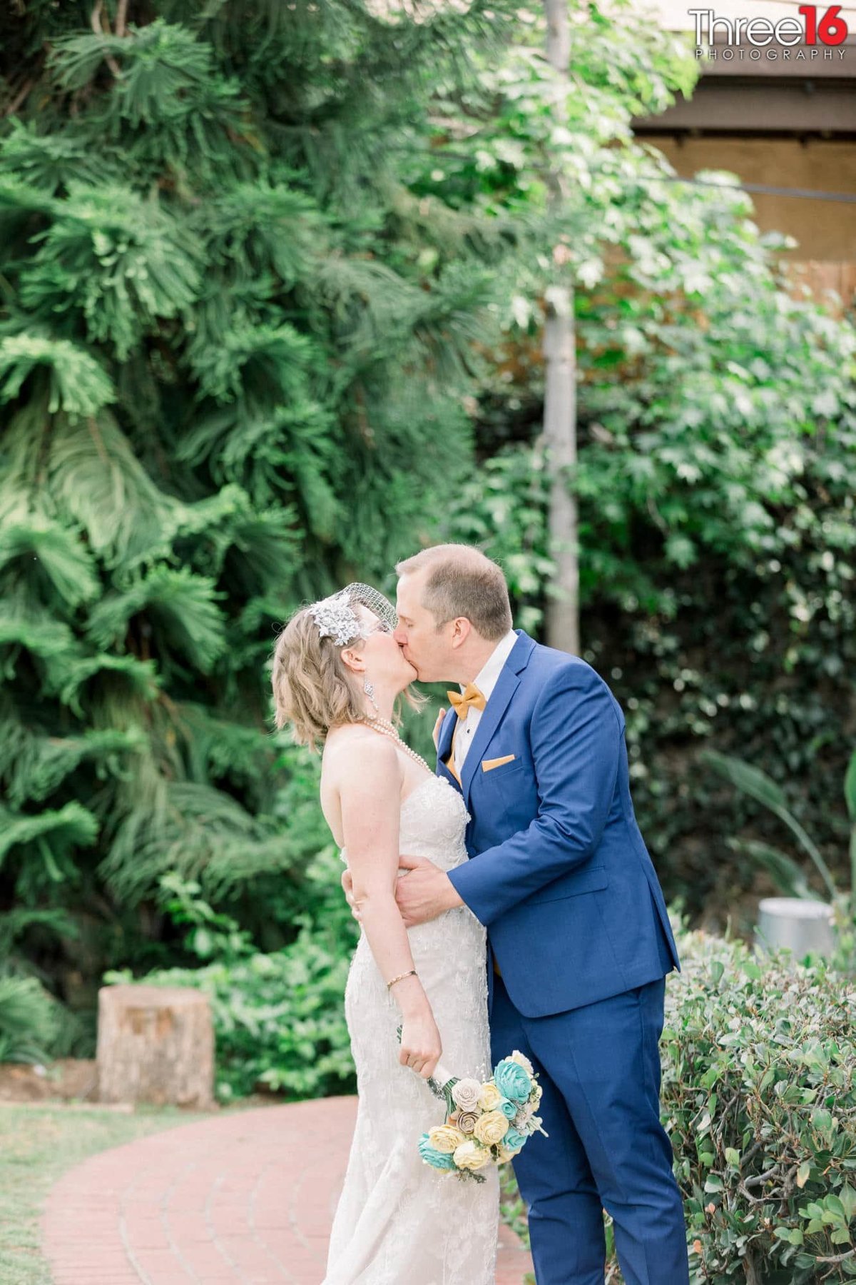 Groom kisses his Bride during the after ceremony photo shoot