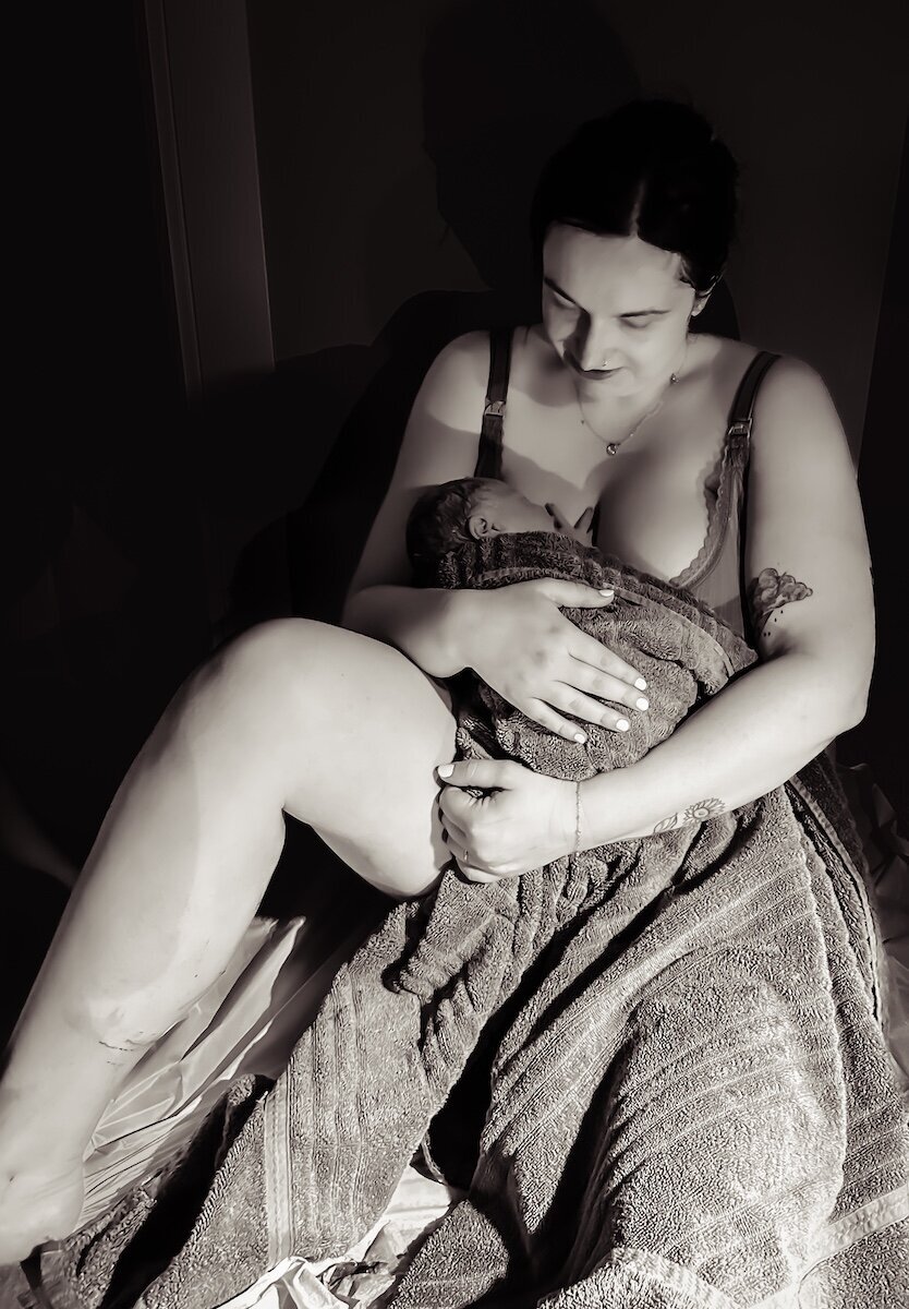 an Edmonton mom holding her baby after giving birth