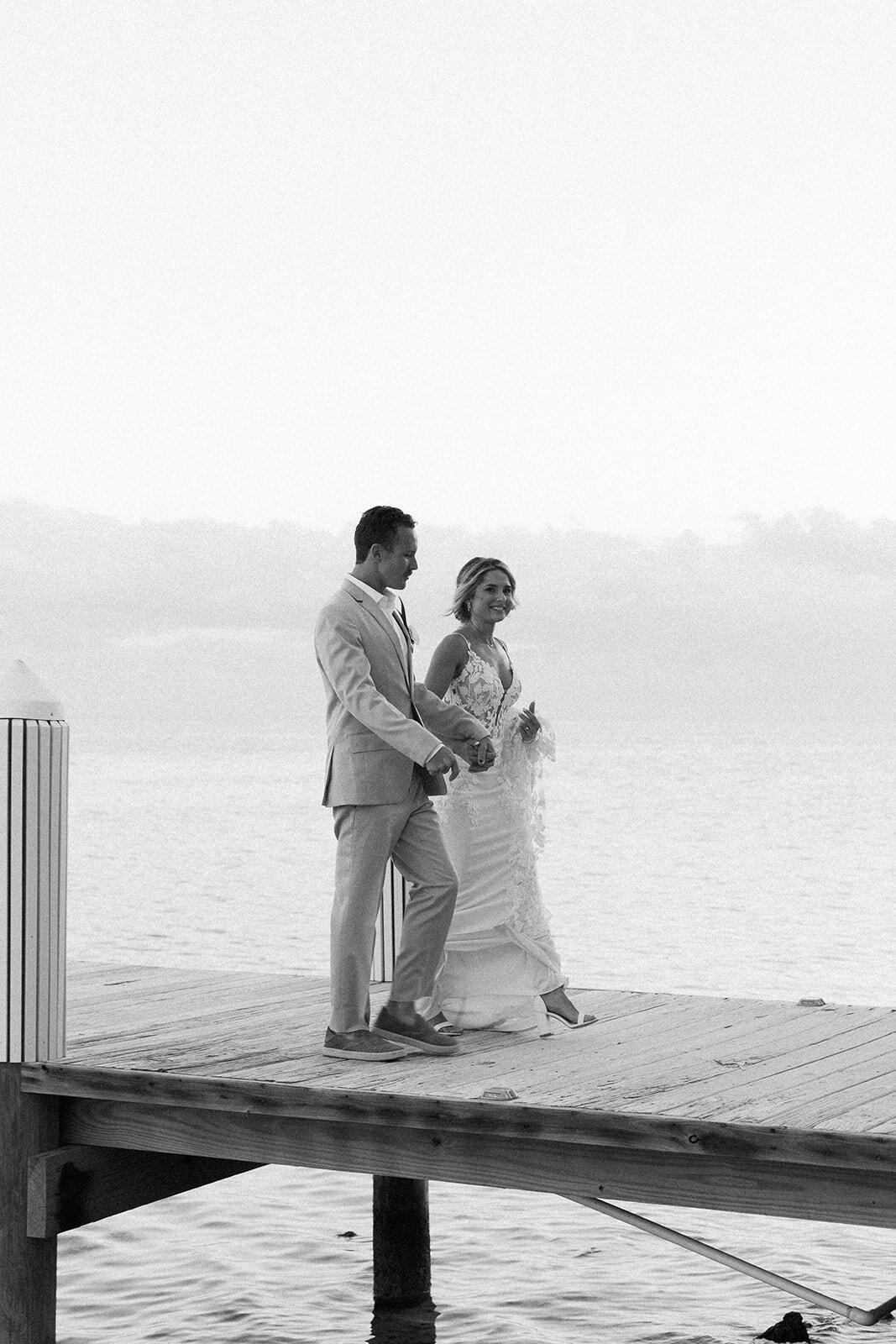 A romantic black-and-white moment as Ashley and Hunter share a sweet moment by the water.