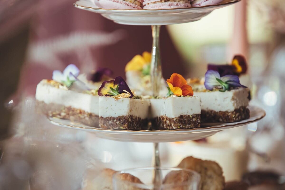 Cakes on middle of the cake stand for afternoon tea