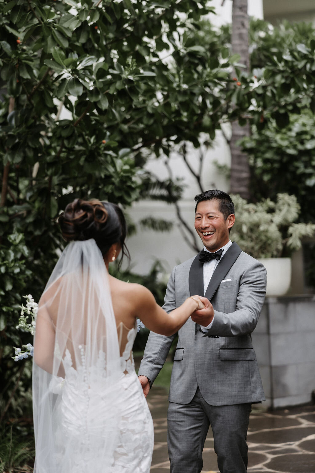 First look with bride and groom, groom is surprised and joyful to see her