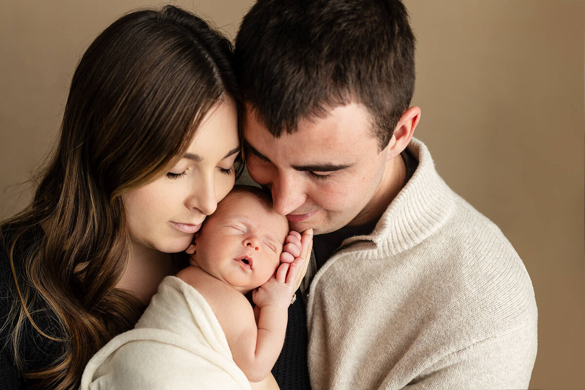 New parents adorn their baby boy.