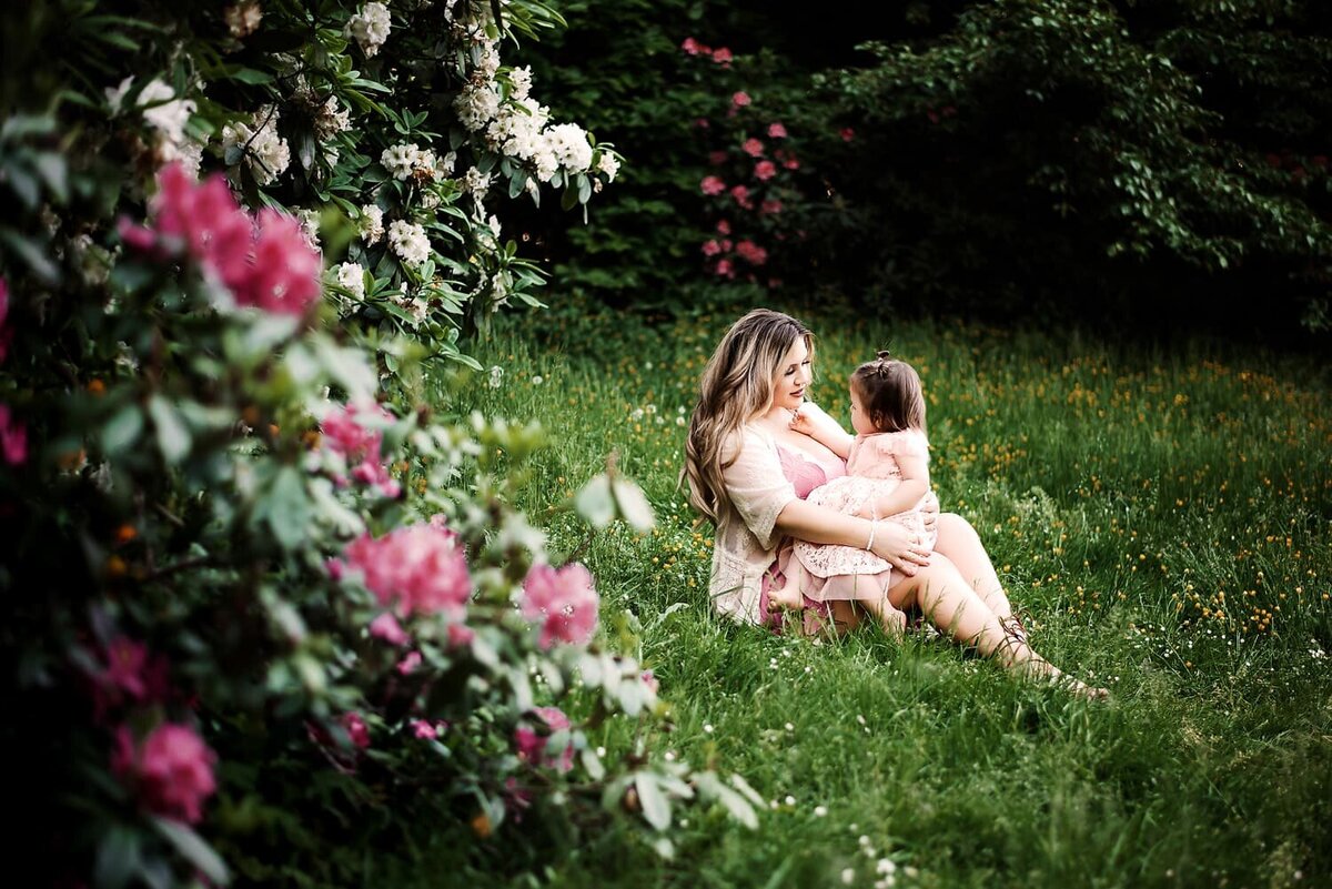 Outdoor family photo session in Vancouver with mom and toddler daughter in pink