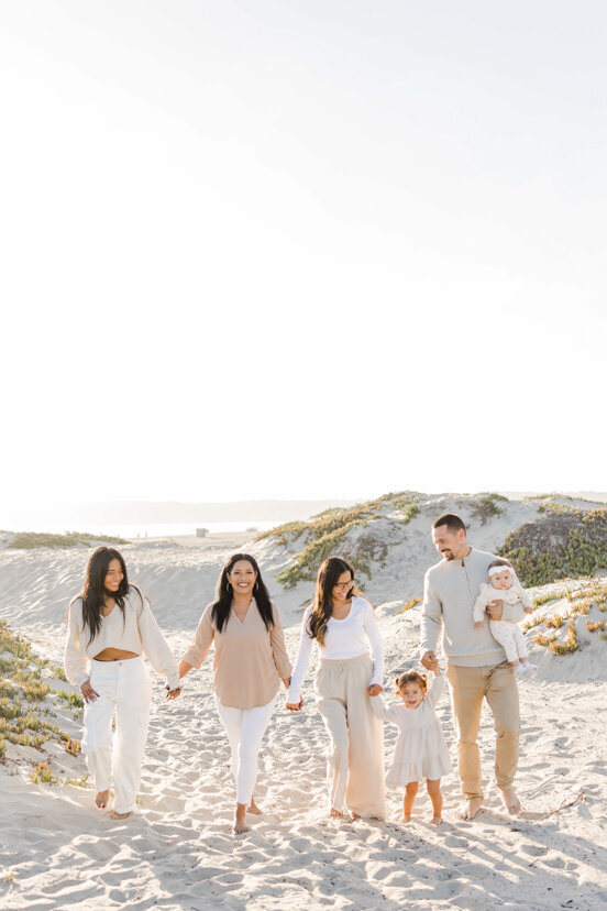 family-of-six-walking-in-Coronado-sand-dune-san-diego