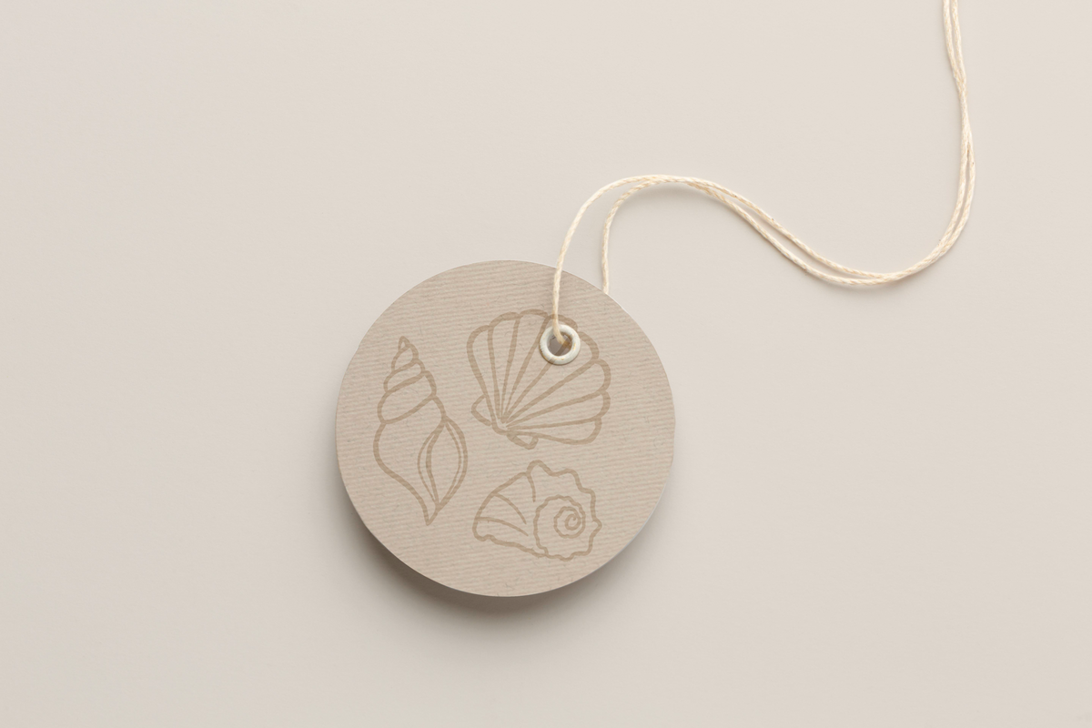 Cute little round, natural label tag with shell illustration