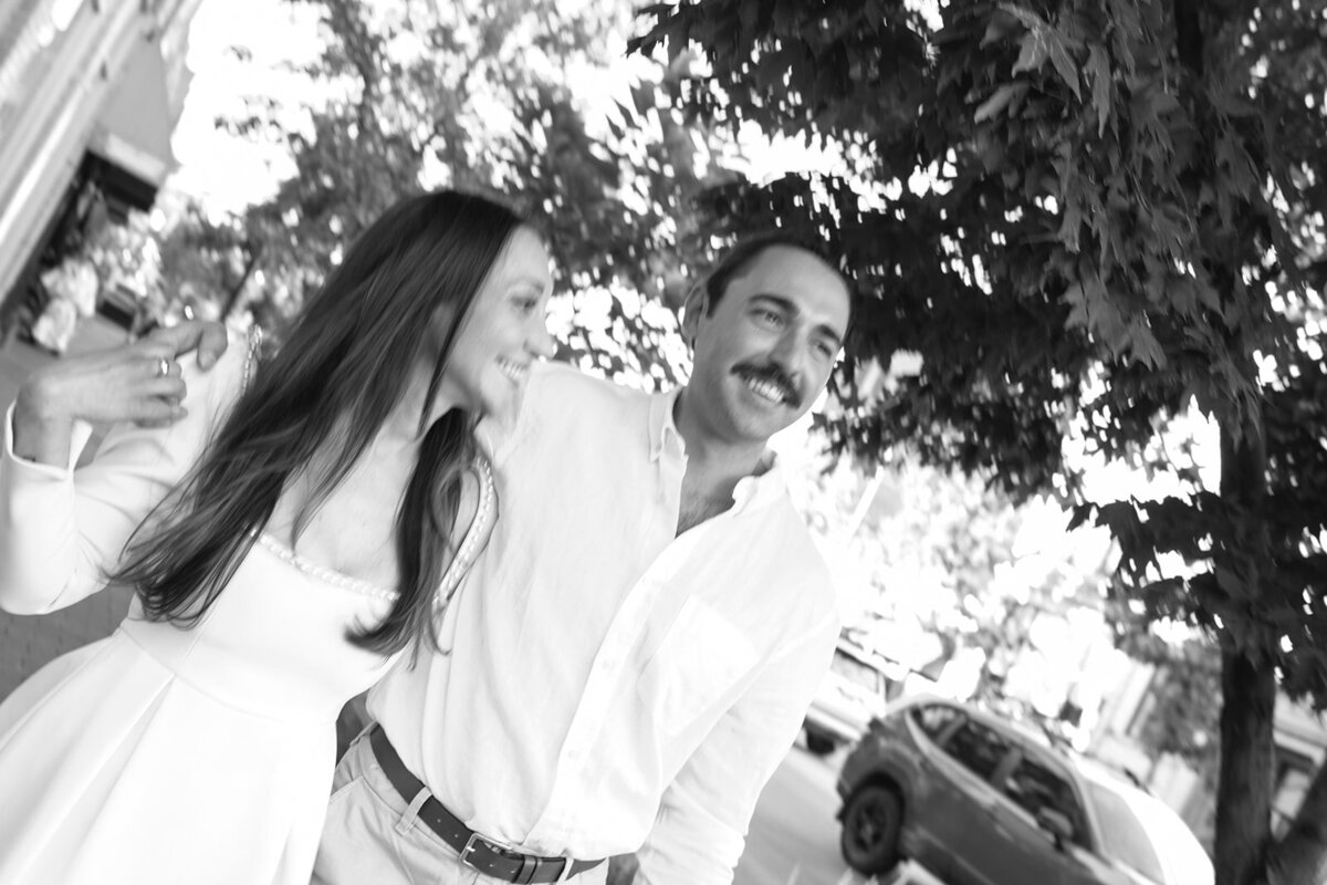 Couple laughing during engagement session in Denver’s foothills