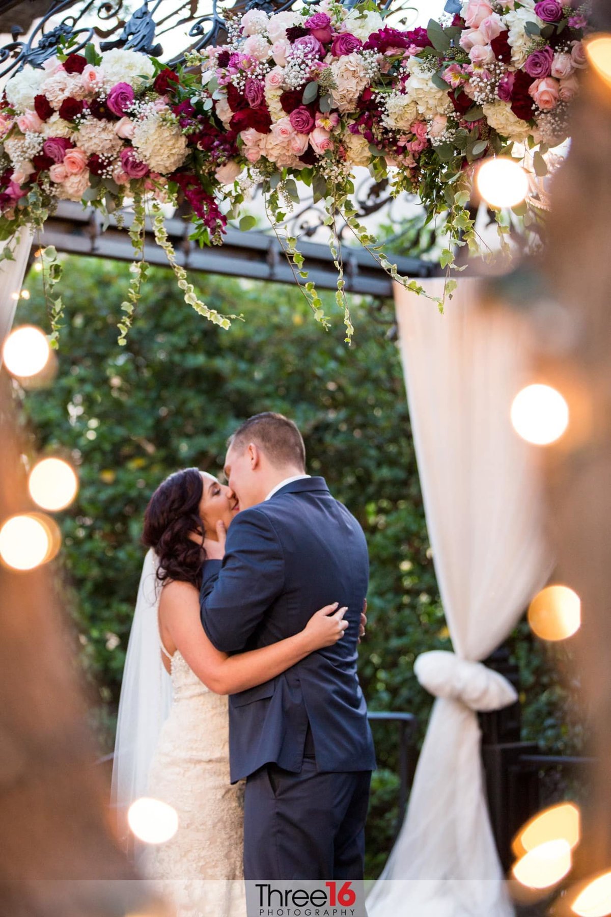 Groom seals the deal with a kiss on his new Bride