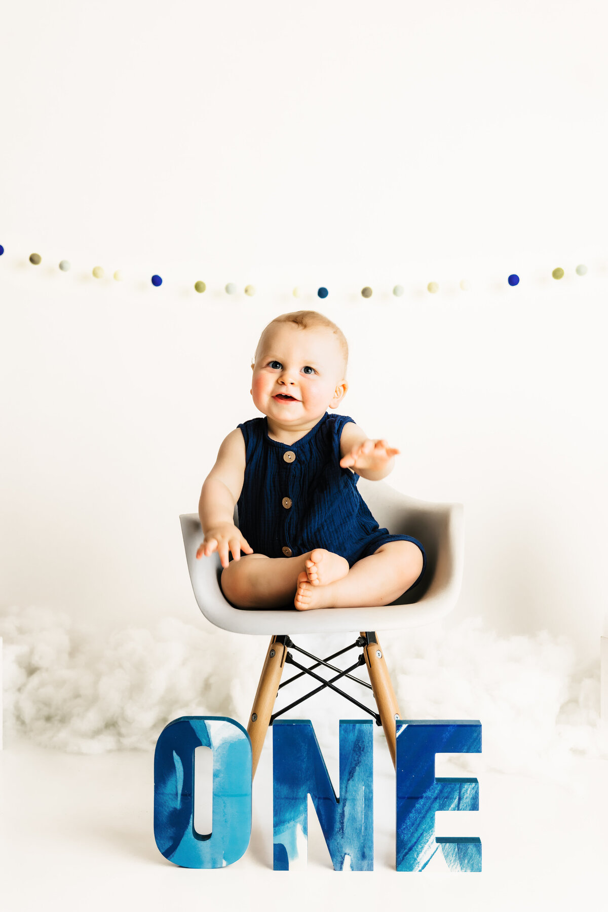 baby boy with one letters sitting in a chair by harrisburg pa baby photographer