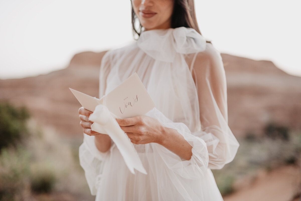 Utah elopement photographer captures wedding gown and vow book