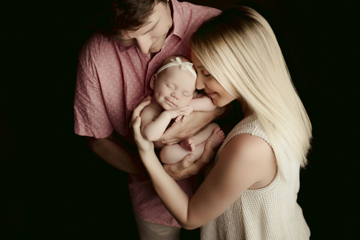 Haili Barton, Austin's leading studio maternity photographer expertly poses her pregnant client during her studio maternity photoshoot. 