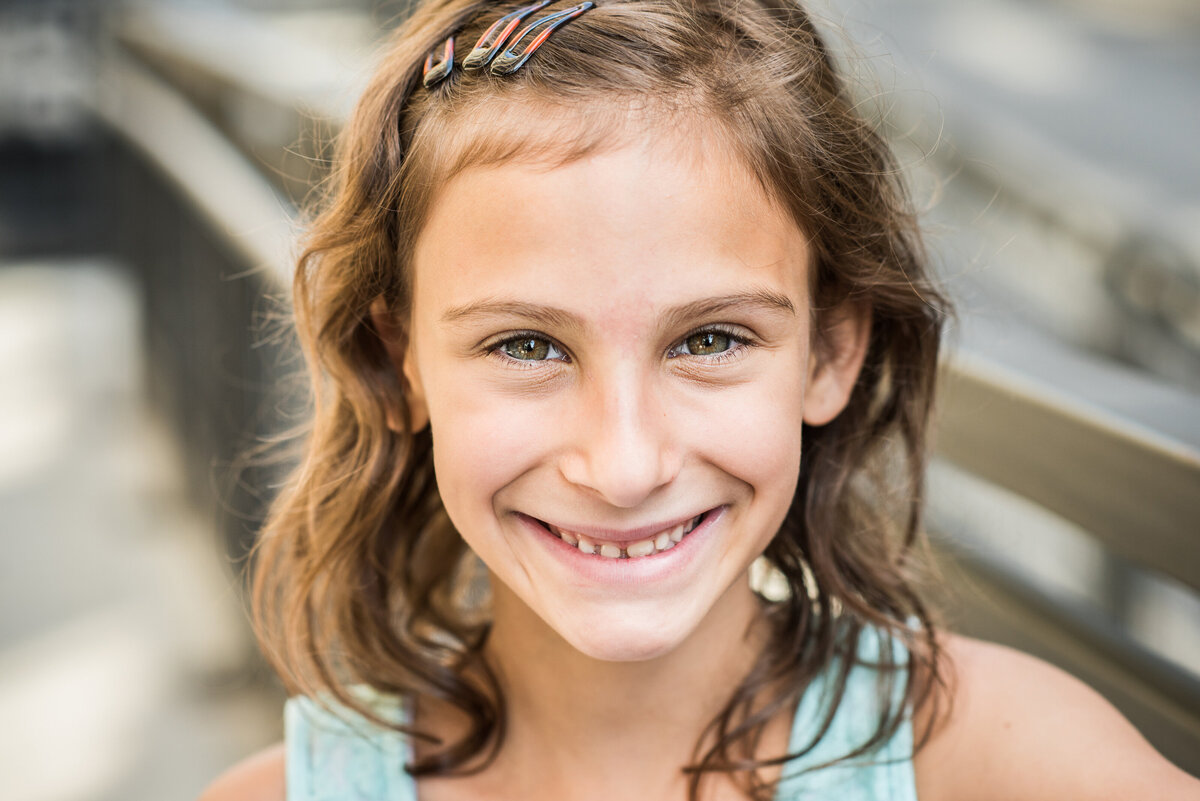 A small girl smiling