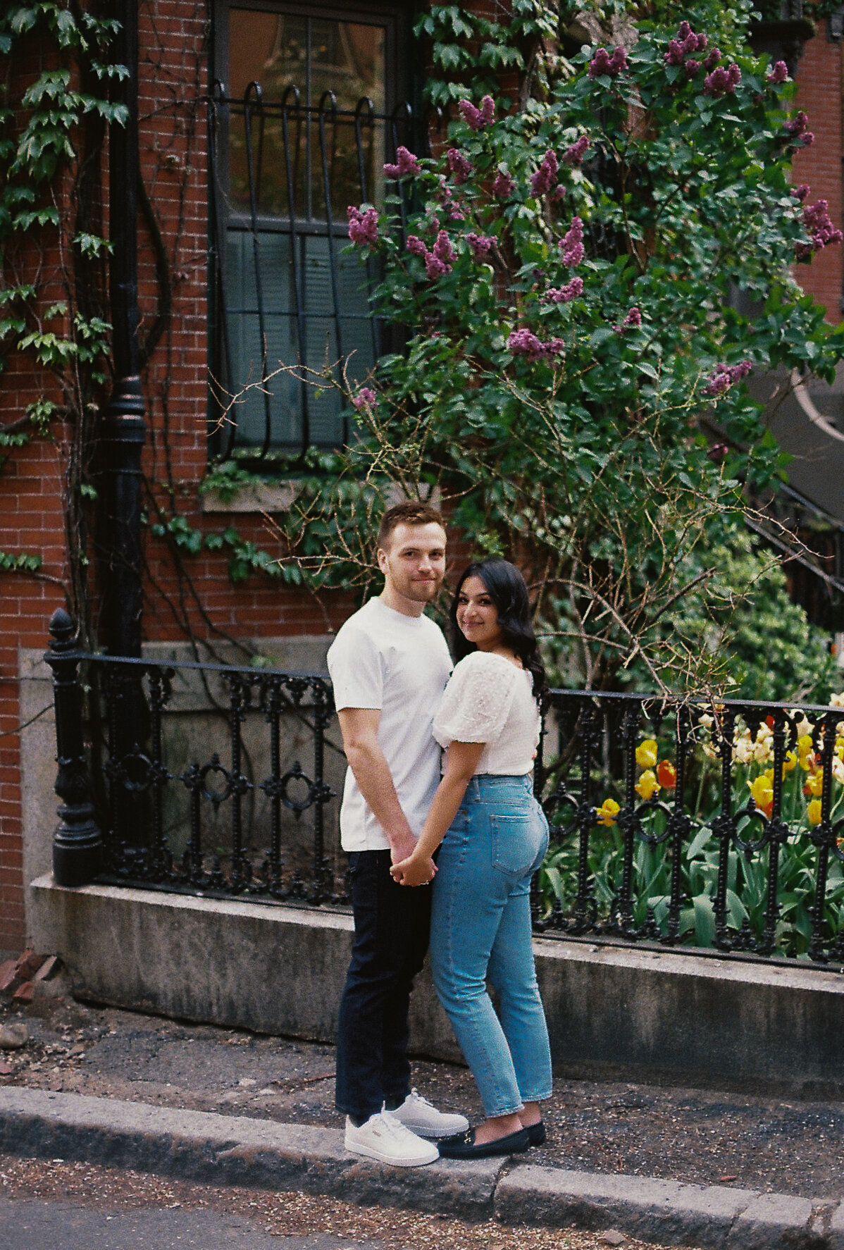 engaged couple on city street