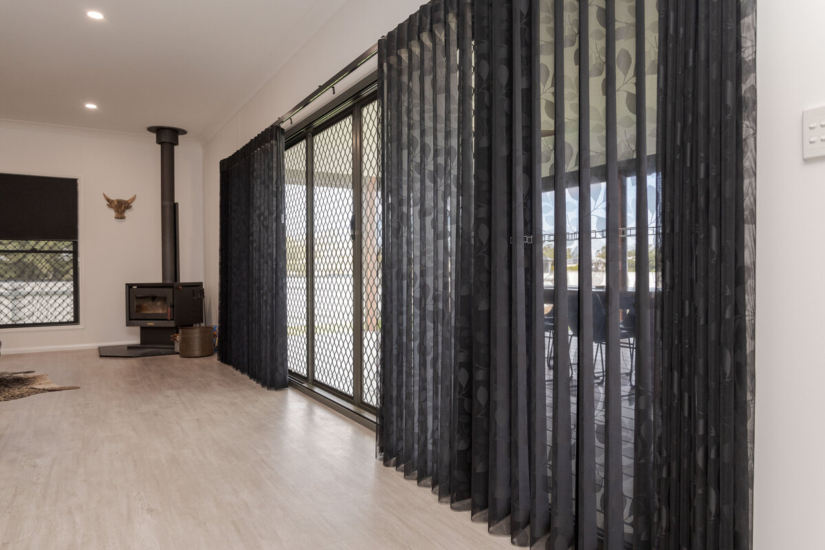 Modern room with S-fold curtains, combining privacy and a polished aesthetic.