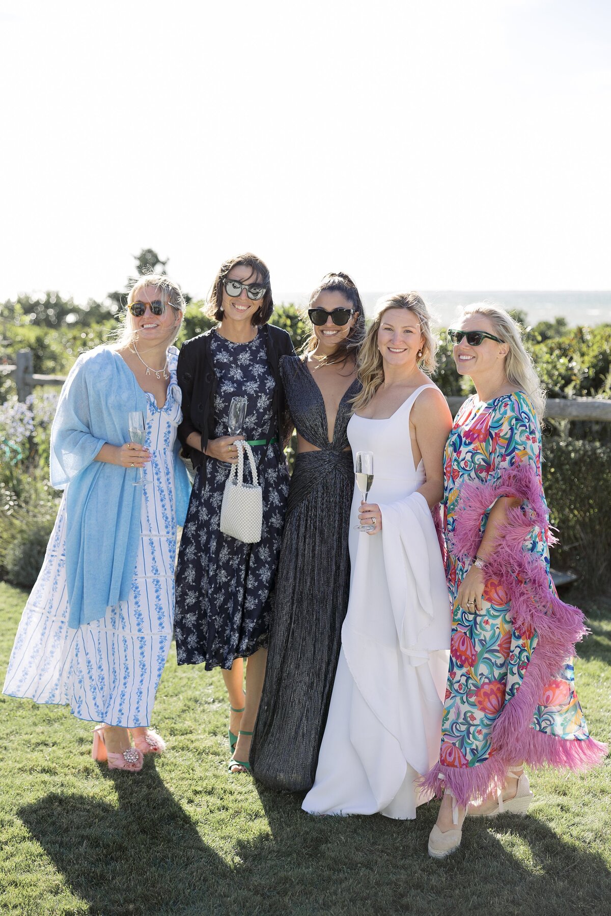 Bride poses with wedding guests during Nantucket wedding.