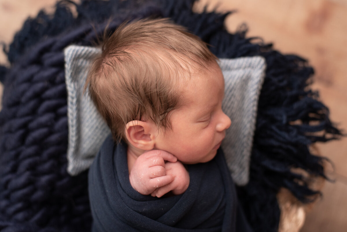 Baby boy, wrapped in blue