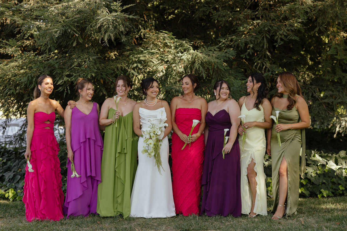 Bride and groom happy with white florals surrounding them