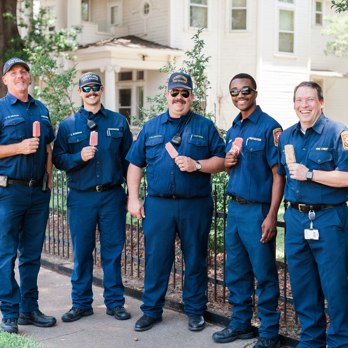 Firefighters eating popscicles at Corsicana Porchfest event