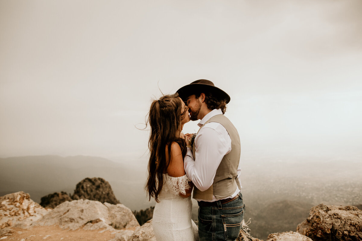 bride and groom kissing at the sandia peak in Albuquerque