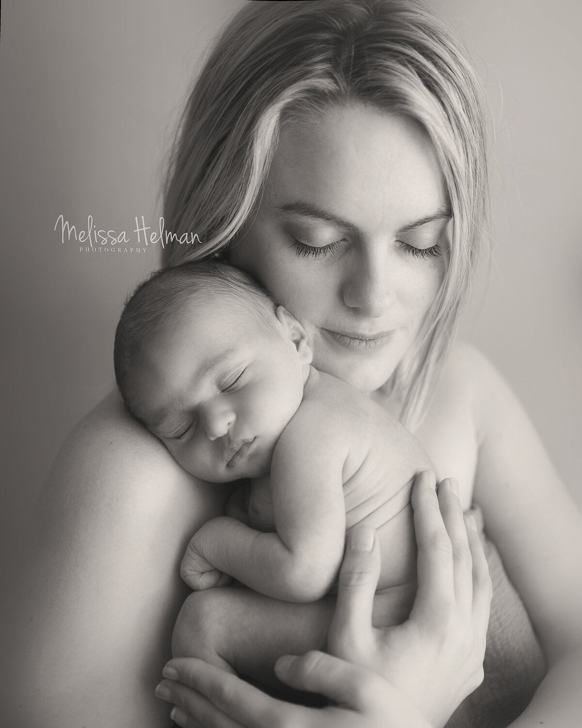 Mom holds son skin to skin in Greensburg photography studio