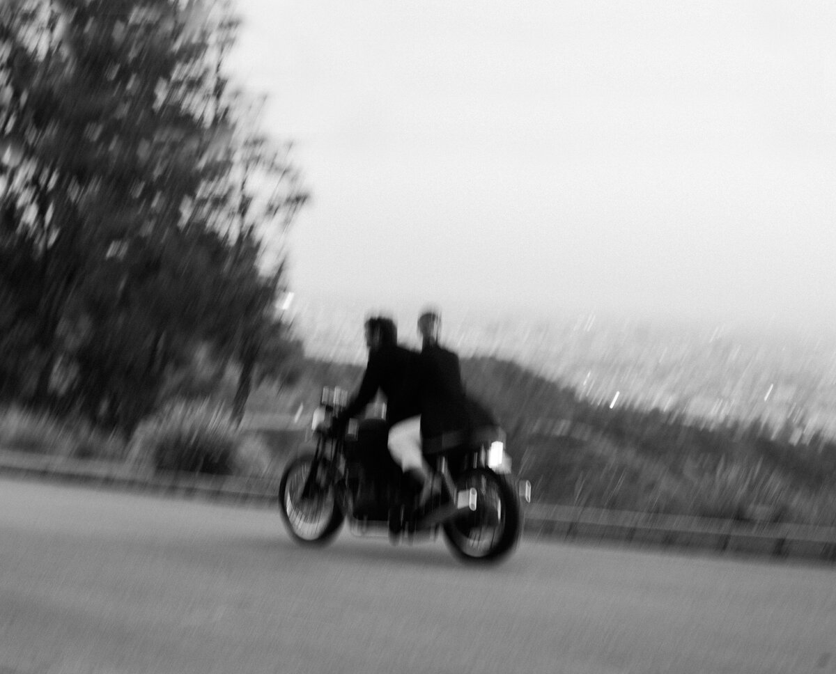 Couple on motorcycle driving in Griffith Park in Los Angeles