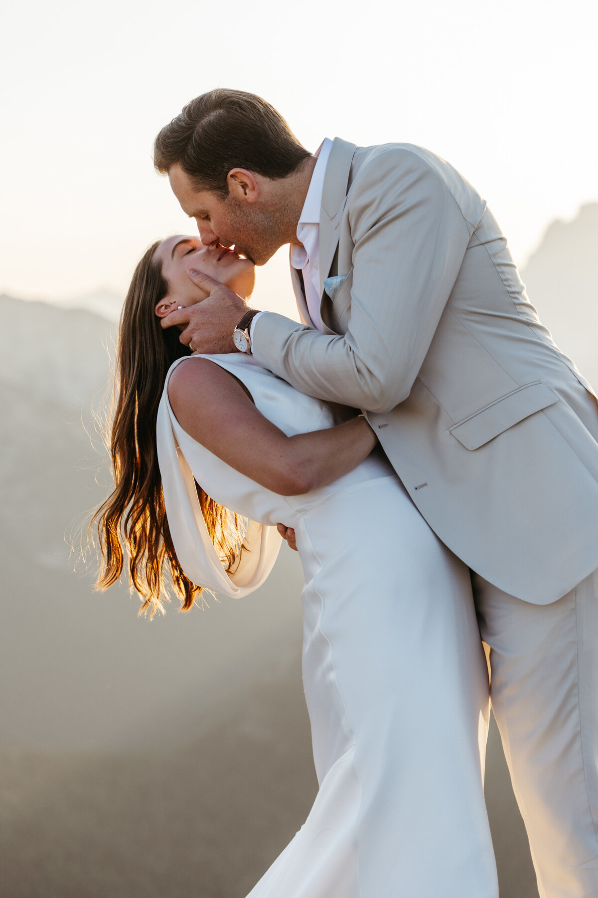 romantic couple kissing in mountain portraits Dolomites elopement