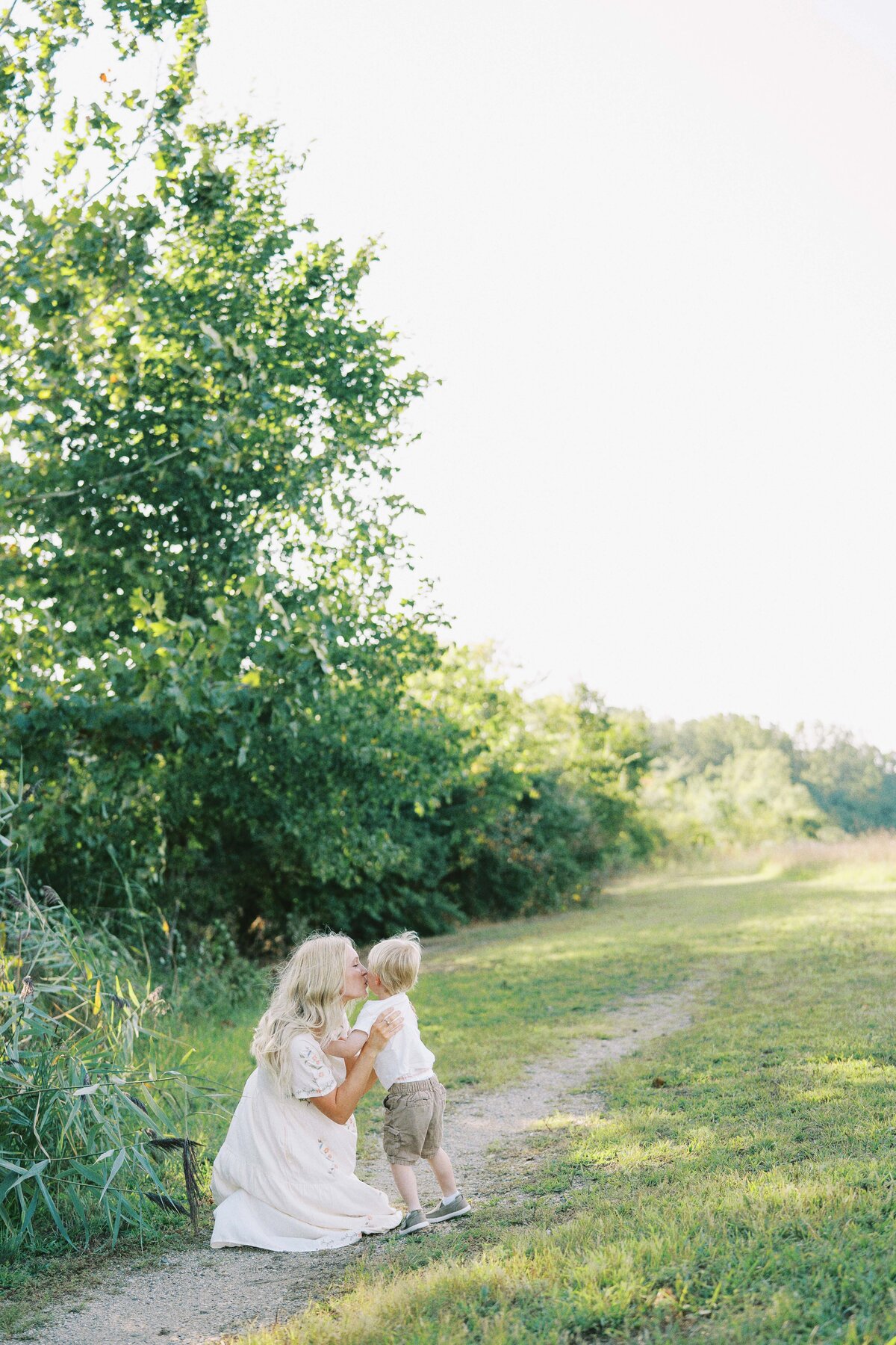 mom kissing her son