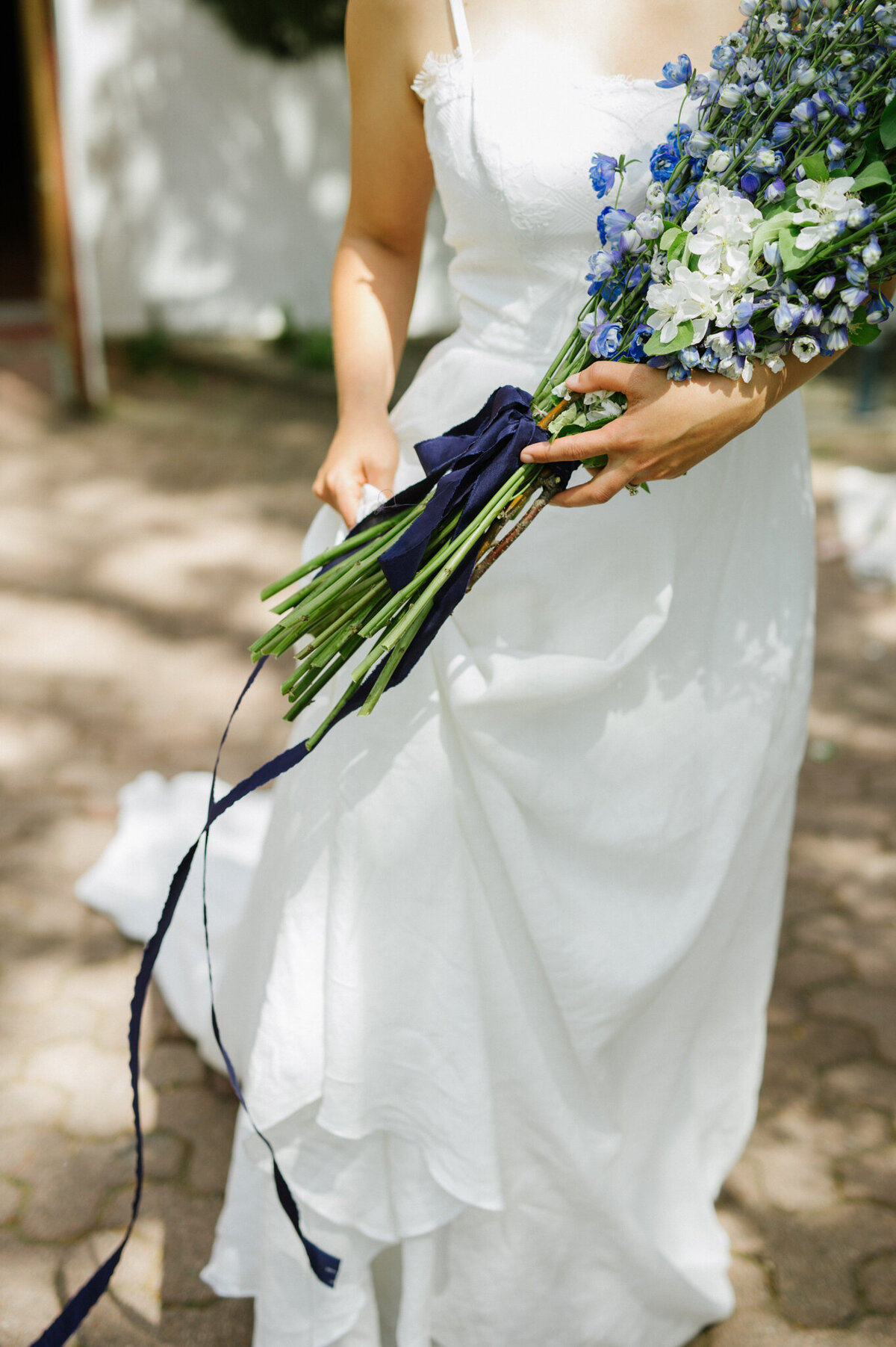 Classic, editorial bridal inspiration, long simple wedding gown, blue and white bouquet, captured by Christy D. Swanberg Photography, editorial elopement and wedding photographer in Calgary, Alberta, featured on the Bronte Bride Vendor Guide.