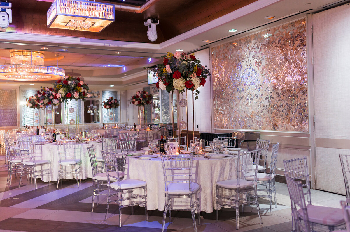 Banquet room at Russo's on the bay.  Table addorned with flowers about tables.
