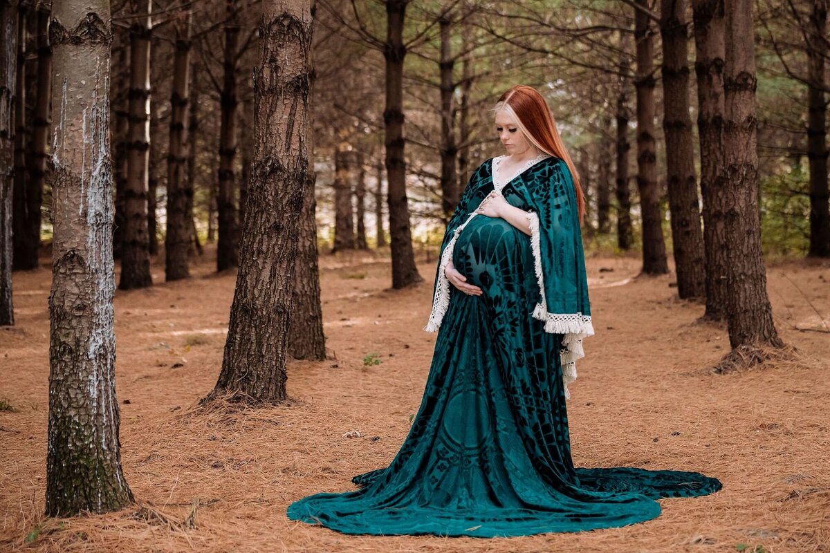 outdoor maternity session wearing velvet