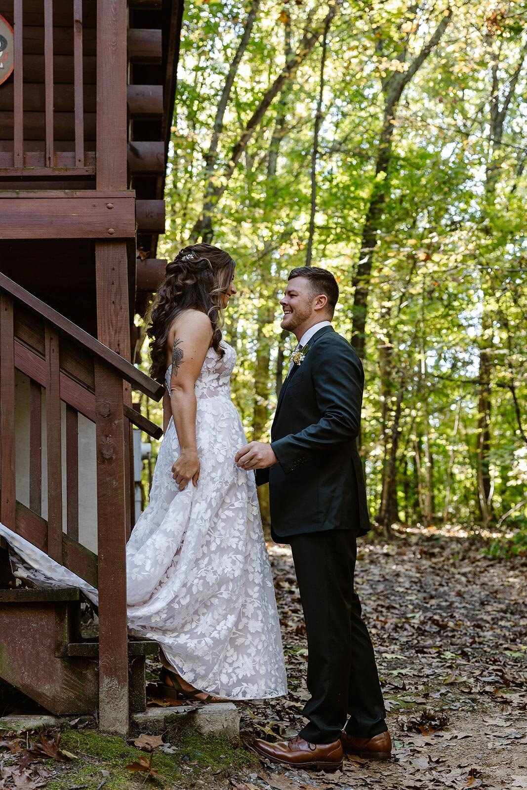 A groom turns around to see his bride for the first time on their wedding day at a summer camp.