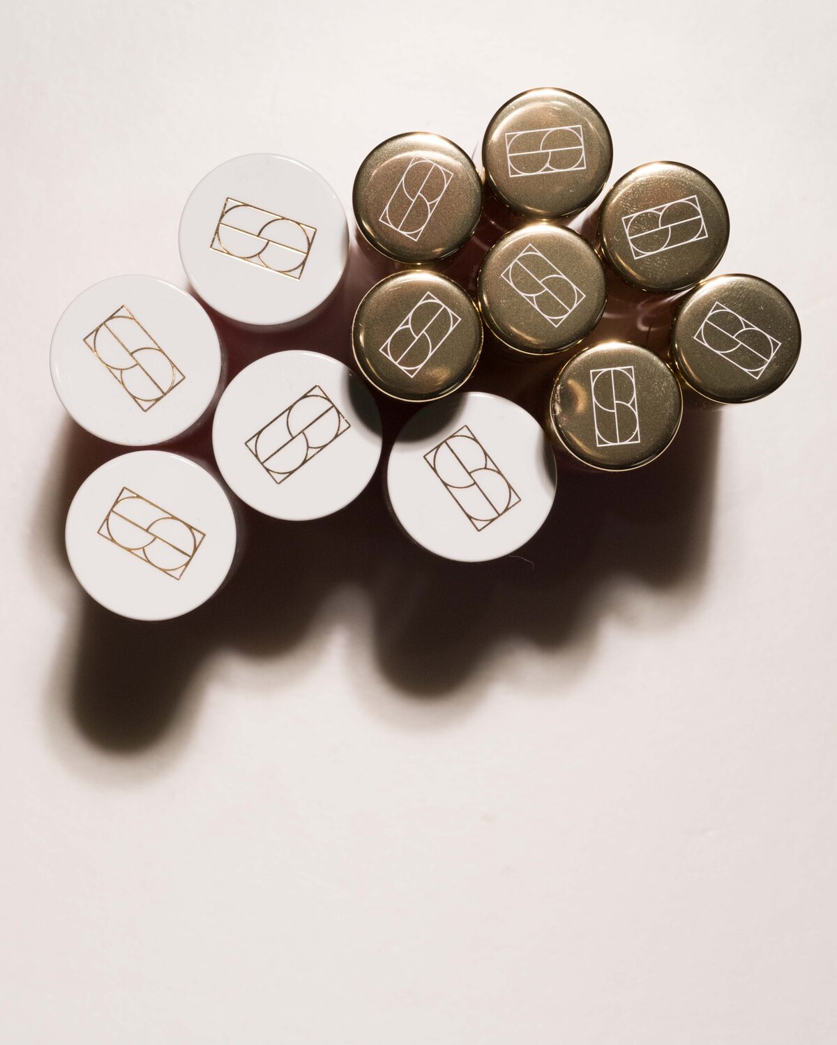 Elegant emblem design featured on premium makeup packaging for a beauty brand.