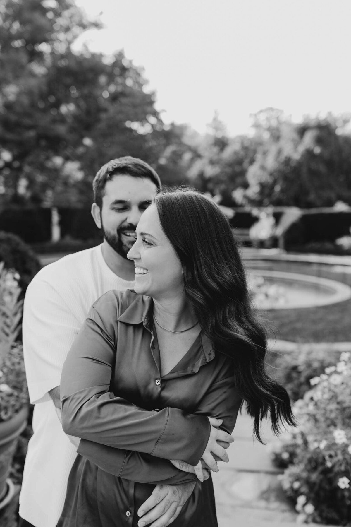 Engaged couple sharing an intimate moment during a black and white South Bend engagement session.