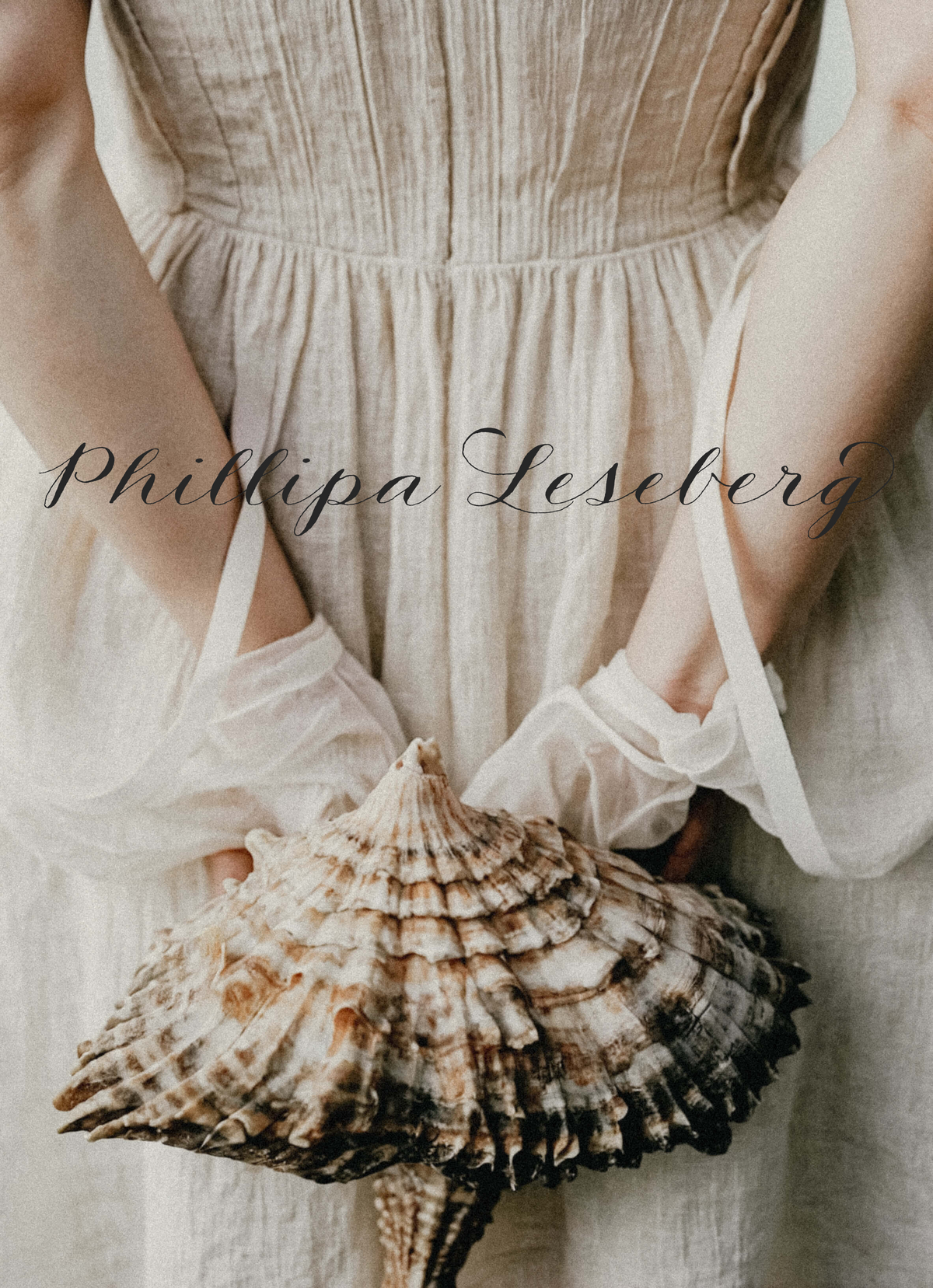 Person in a light, vintage-style dress and sheer gloves holds a large seashell behind their back. The name "Phillipa Leseberg" and Sweet Pea Ink Creative appear across the image, hinting at thoughtful brand design inspiration.