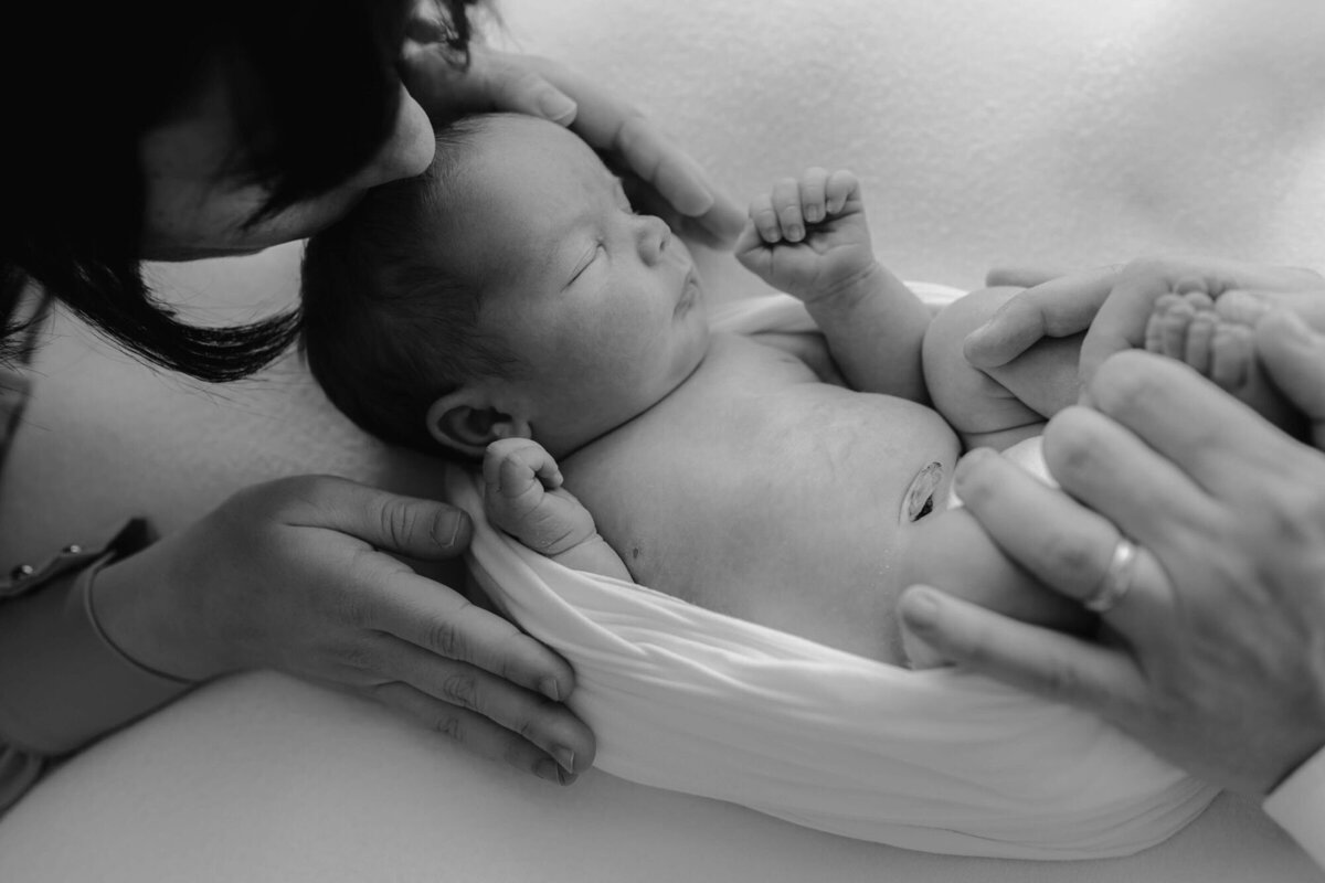 Baby wrapped in neutral swaddle, captured by San Francisco Bay Area newborn photographer.
