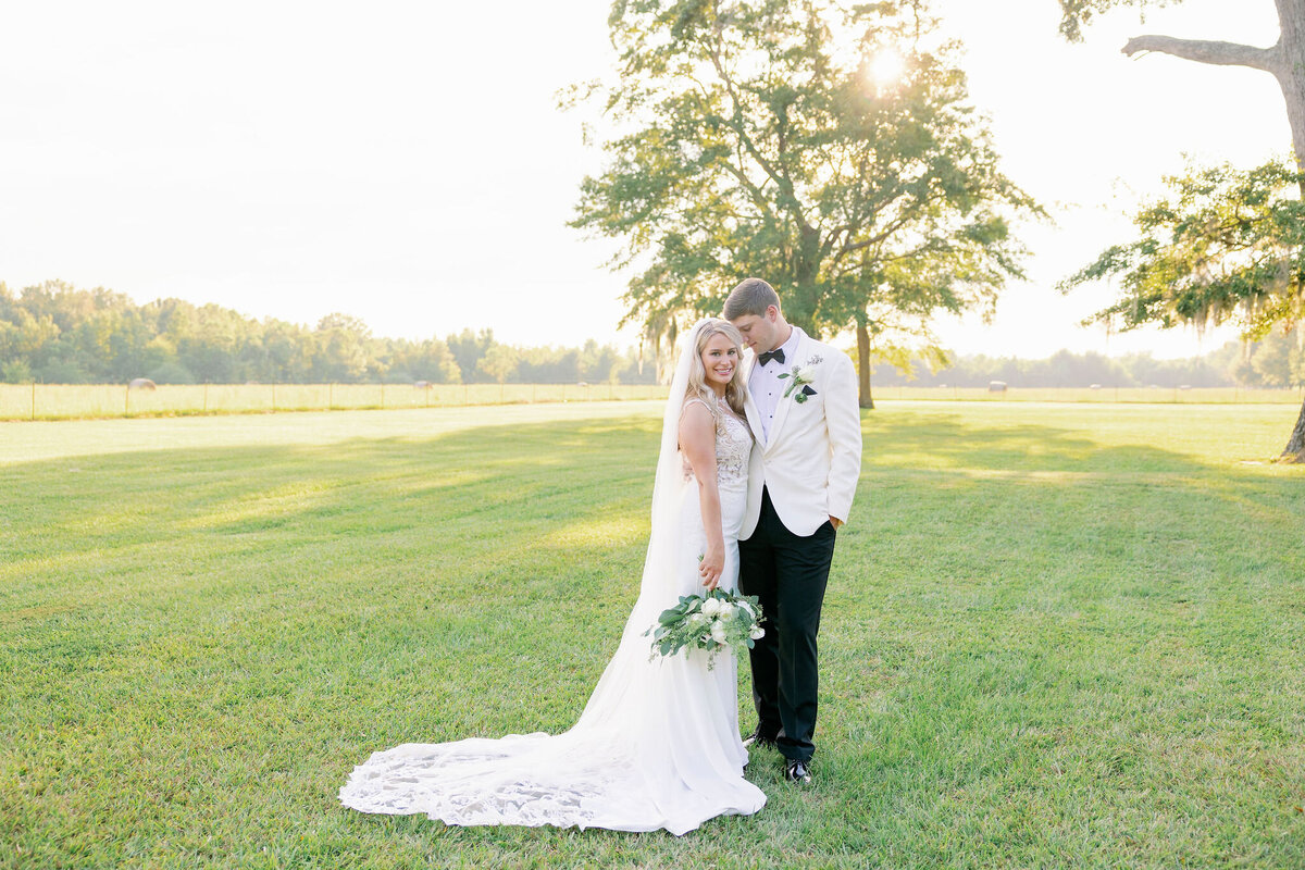 Couple smiling in a field