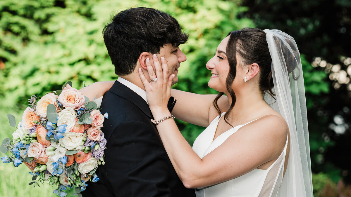 Bride and groom sharing a joyful embrace on their wedding day, captured in a black and white portrait by Alex Kaplan Wedding Photography in New York City and Northern New Jersey.