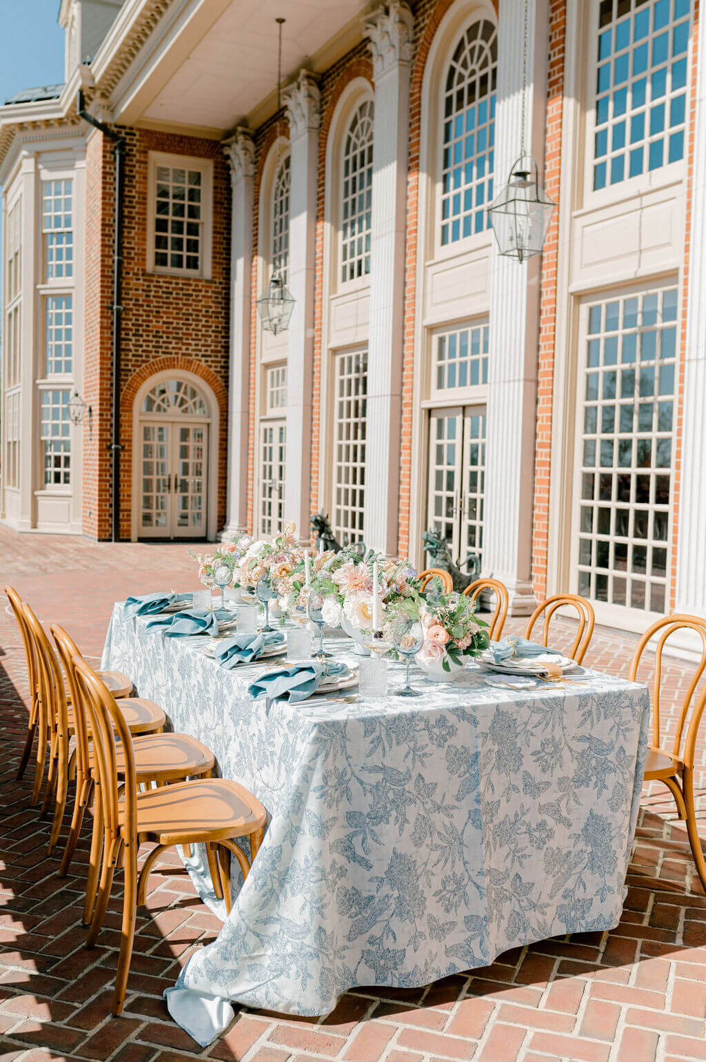 Blue and peach wedding tablescape at Virginia wedding venue Estate at River Run
