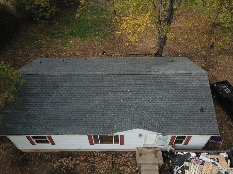 Completed roofing project on a small home, showing durable shingles installed by Black Bear Roofing.