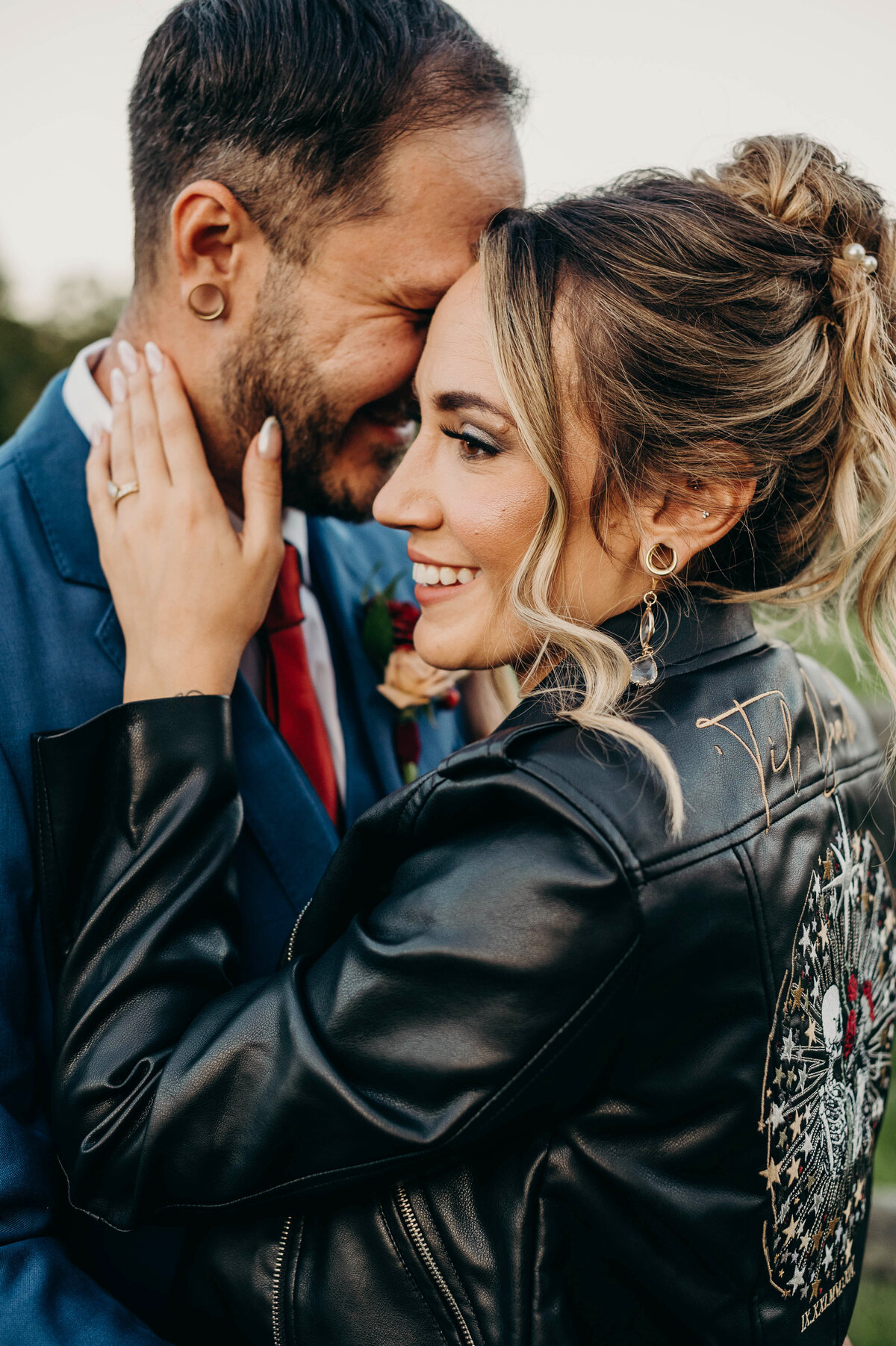 Groom whispering sweetly in bride's ear, capturing a romantic and intimate moment on their wedding day | Pittsburgh Wedding Photography