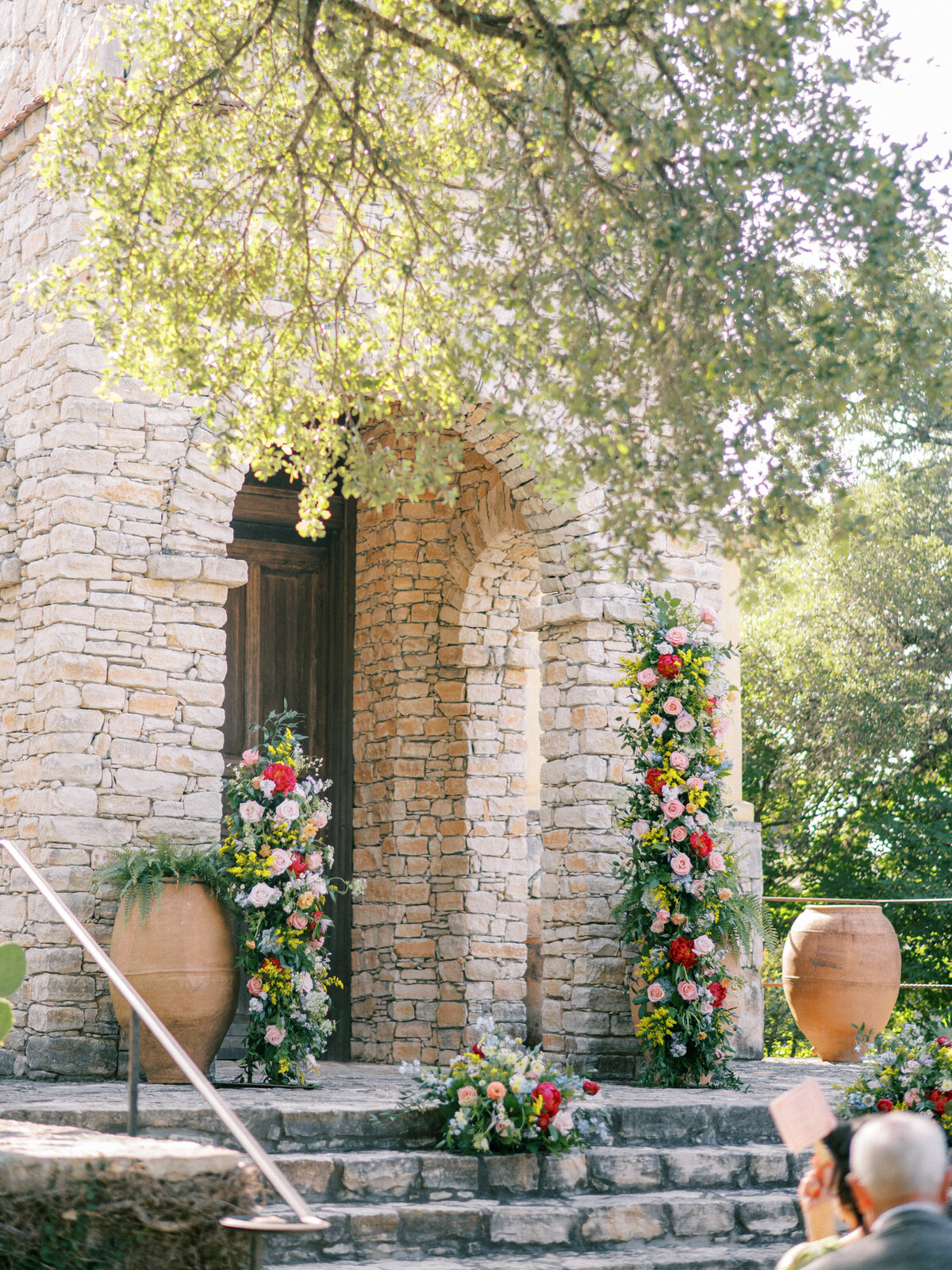 Garden party florals in wedding ceremony