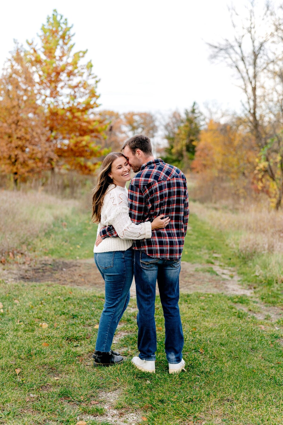 engagement-session-fall-whispering-in-ear