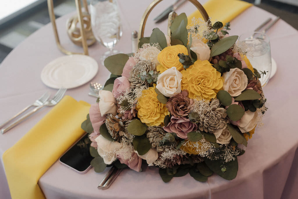 A bouquet of flowers sitting on a table.