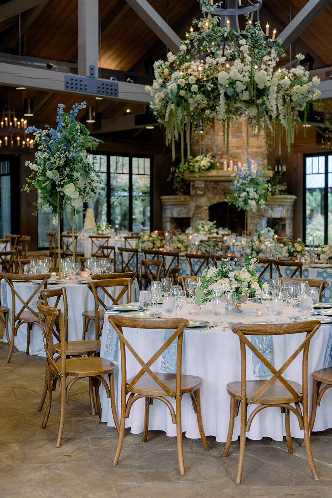 Suspended floral chandelier with cascading greenery, white roses, and hydrangeas at a luxury wedding reception at Old Edwards Inn in Highlands, North Carolina.