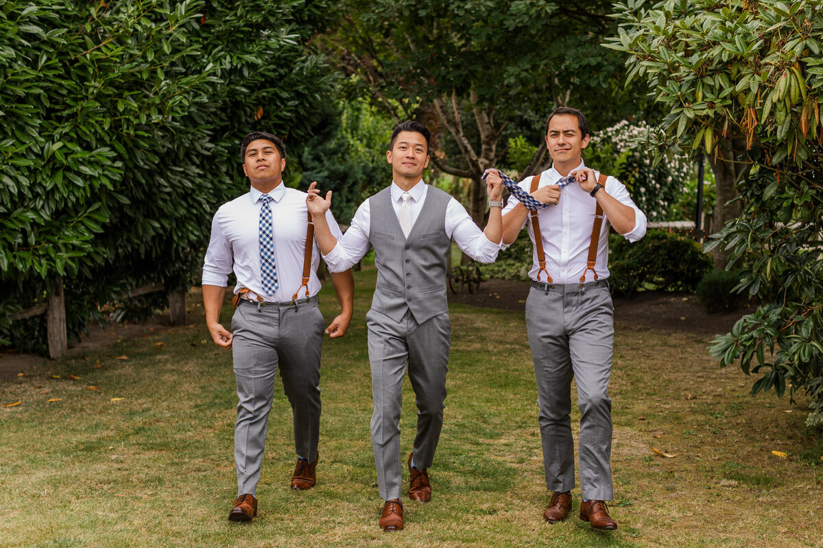Groom-and-his-groomsmen-having-fun-during-wedding-party-photos-at-rustic-farm-wedding-venue-Craven-Farm-in-Snohomish-WA-photo-by-Joanna-Monger-Photography