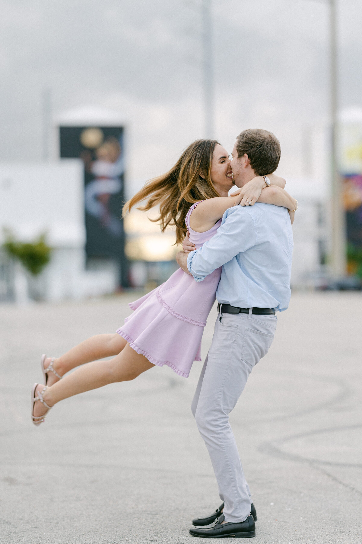 Couple sharing a joyful embrace during their engagement session in Miami, captured by Rodrigo Varela Photography.